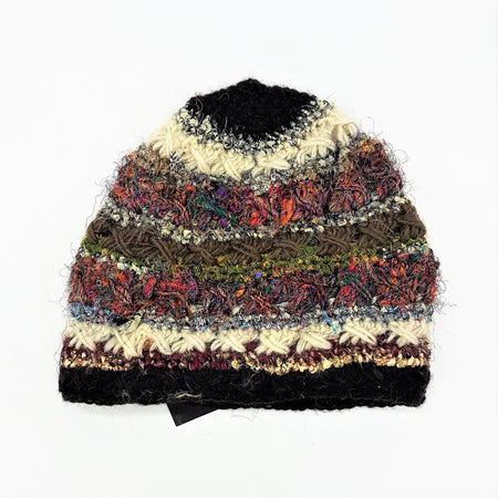 A wool and silk hand-knitted beanie hat with vibrant multicolored stripes and textured crochet details for adults