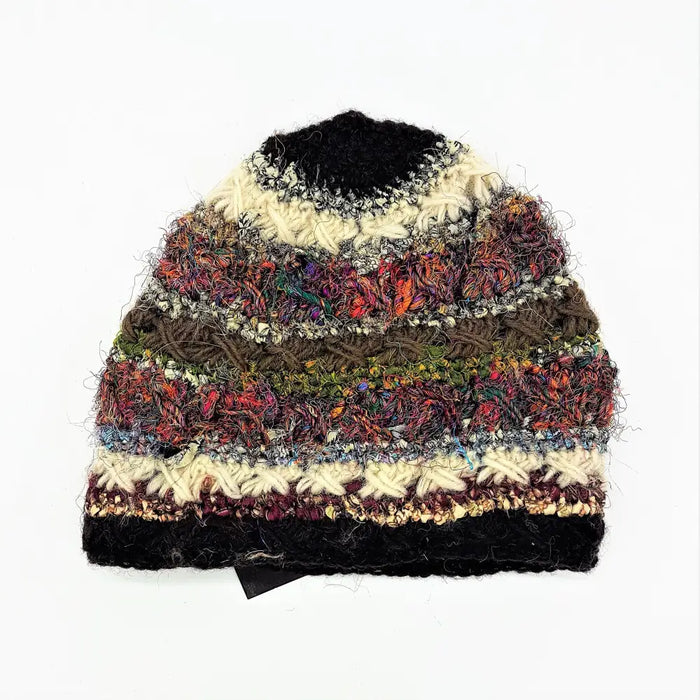 A wool and silk hand-knitted beanie hat with vibrant multicolored stripes and textured crochet details for adults