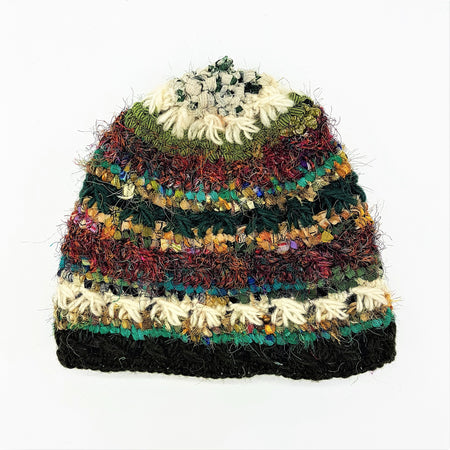 A wool and silk beanie hat with multicolored horizontal stripes in green red beige and black knit in a textured pattern