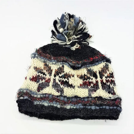 Hand knitted wool and silk bobble hat in cream black and maroon with a multicolored yarn pom pom on top