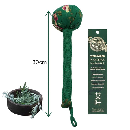 Green fabric-wrapped wormwood massage hammer with floral embroidery and braided rope handle for wormwood massage