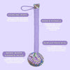 A lavender wormwood massage hammer with a rope-wrapped wooden handle and an herb-filled patterned head