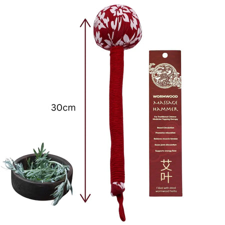 Red fabric-wrapped wormwood massage hammer with a white floral patterned head for wormwood massage use