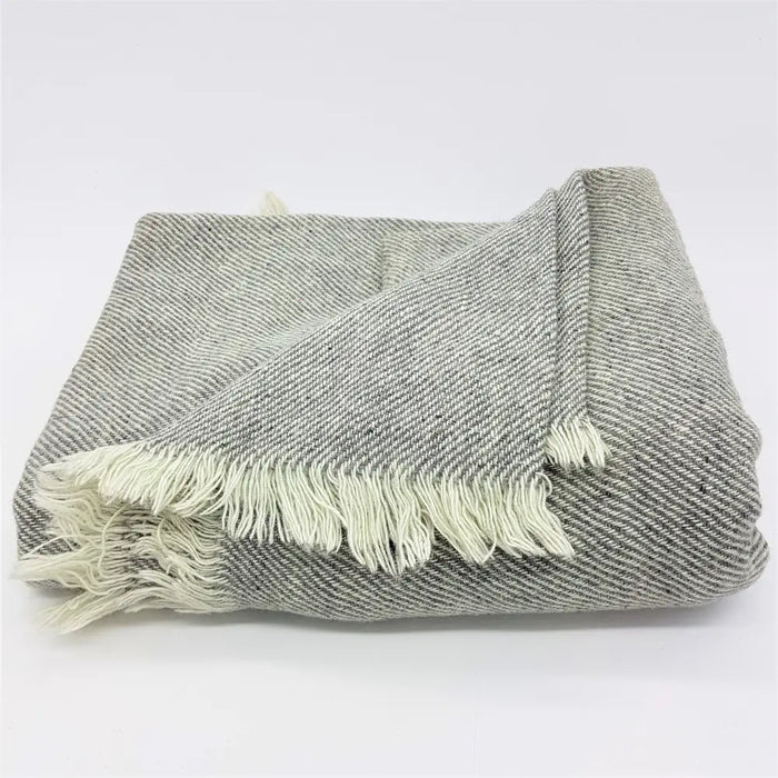 Gray and white herringbone patterned woven woollen shawl with soft fringed edges for cozy use