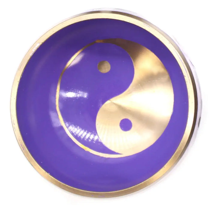Purple and gold tibetan singing bowl set with yin yang symbol and yang symbol design in white and purple colors