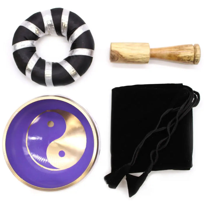 Purple and gold yin yan symbol singing bowl set with wooden mallet and black velvet pouch for meditation