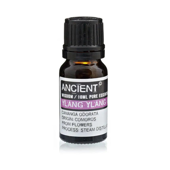 A dark amber glass bottle with a black cap and white label of ancient wisdom ylang ylang essential oil 10ml