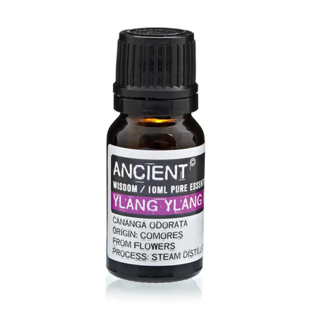 A small amber glass bottle of ylang ylang essential oil with a black cap and a white label in purple text