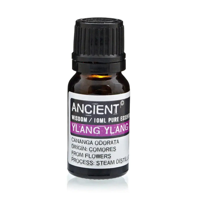 A small amber glass bottle of ylang ylang essential oil with a black cap and a white label in purple text