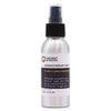 A sleek silver spray bottle with black nozzle labeled ancient wisdom aromatherapy mist ylang ylang essential and mandarin essential oil